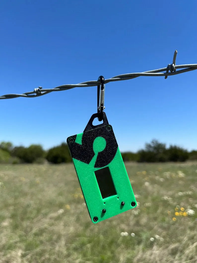 Spec5 MiniTrekker in Spec5 Green, black face and carabiner tab, the node used on the MeshData bench.